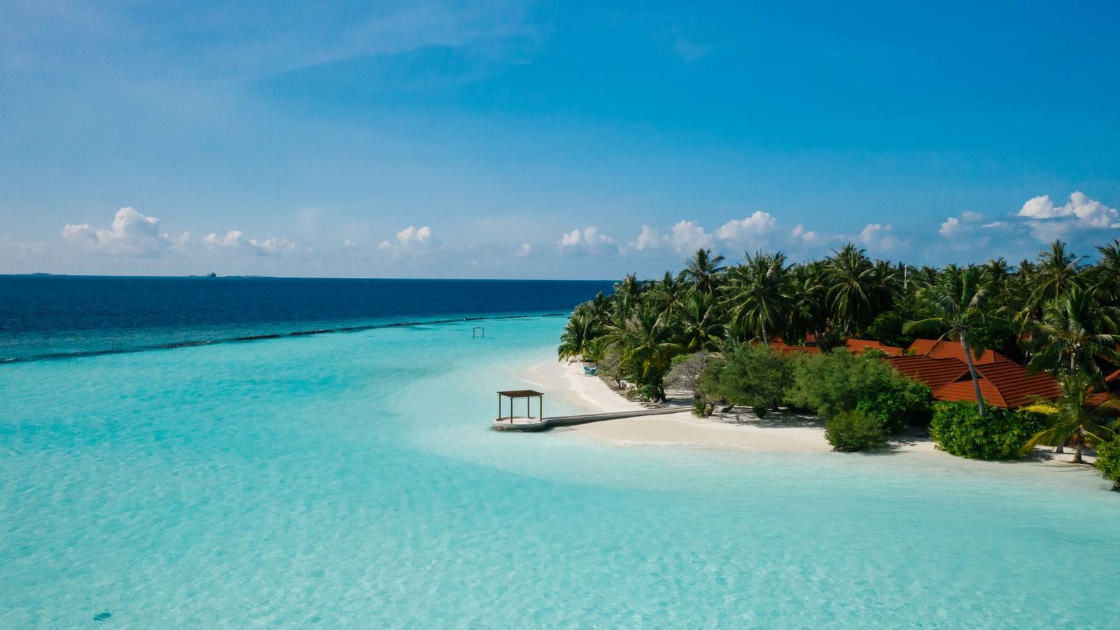 Aerial view of a turquoise bay and white-sand beach